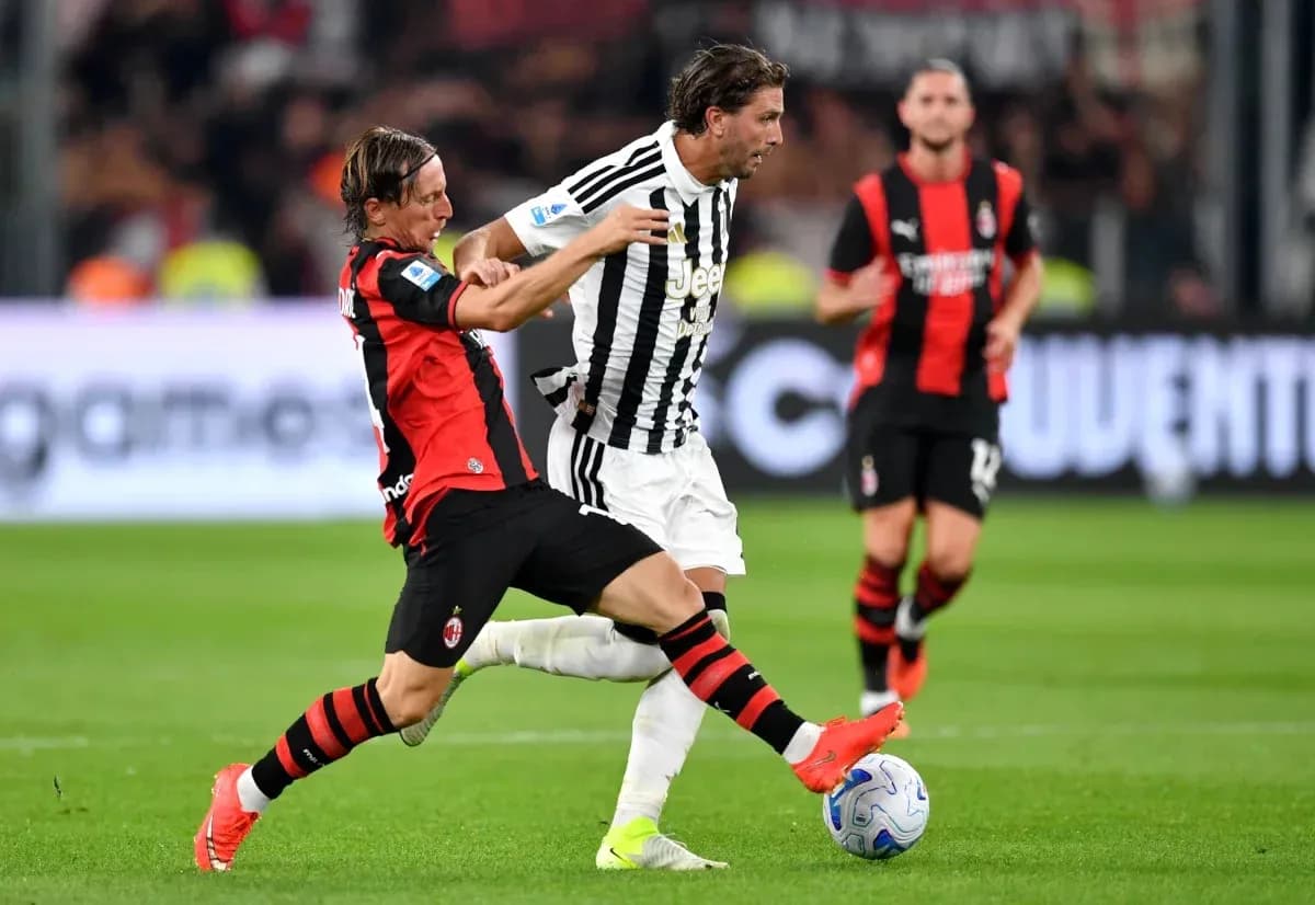 Player tackling opponent during Serie A match Player tackling opponent during Serie A match