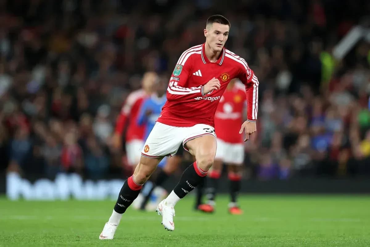 Player running with ball during Manchester United match Player running with ball during Manchester United match