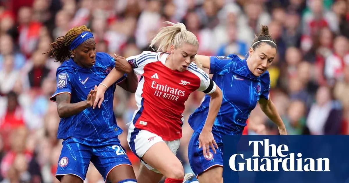 Arsenal player challenged by two Chelsea defenders Arsenal player challenged by two Chelsea defenders