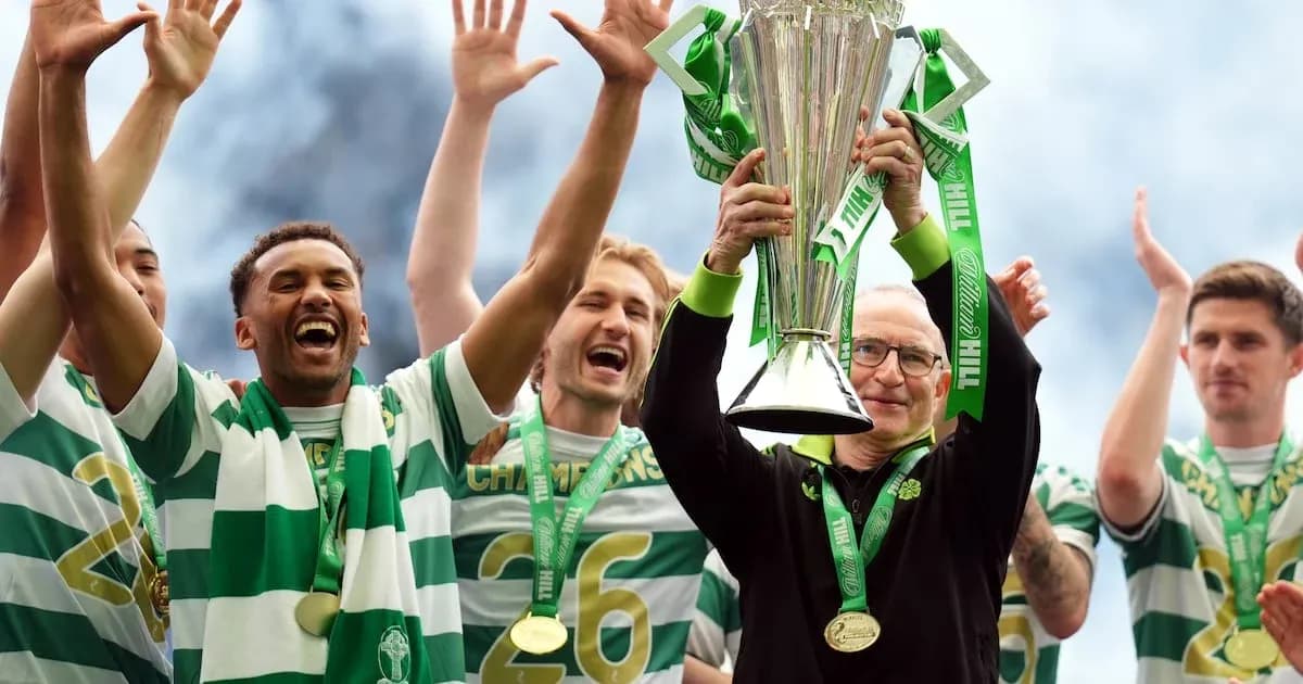 Celtic players celebrating with trophy after victory Celtic players celebrating with trophy after victory