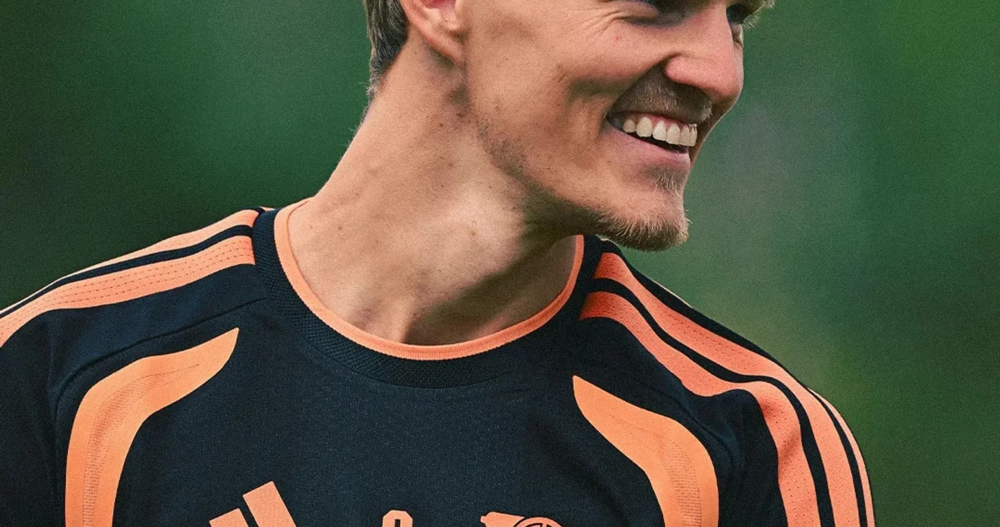 Player smiling in training kit during practice session Player smiling in training kit during practice session