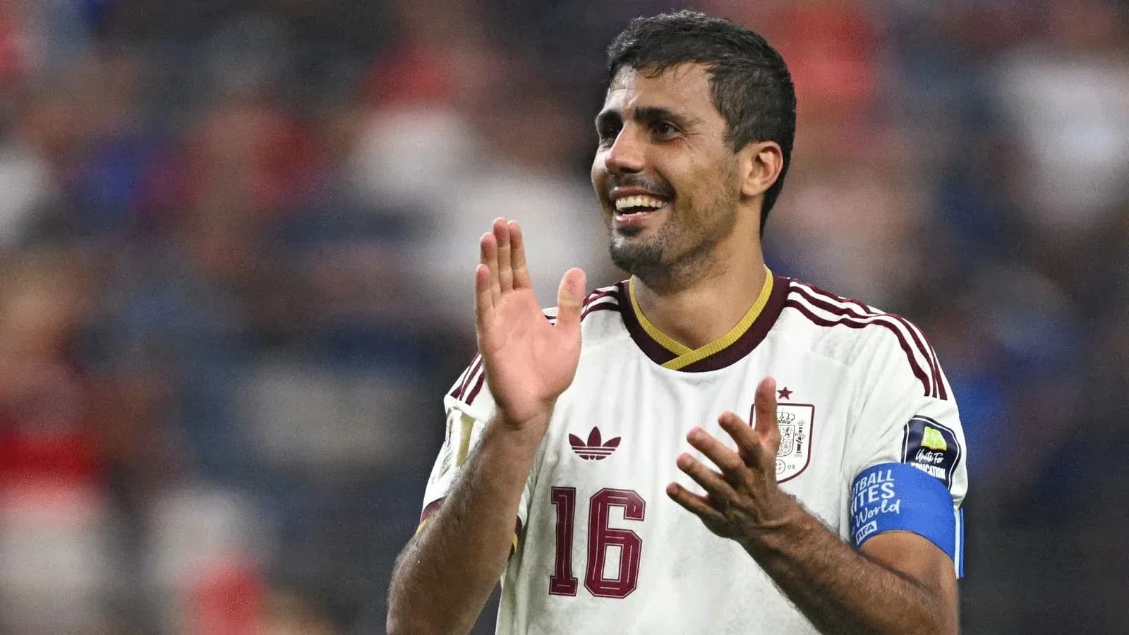Player celebrating with applause during a match Player celebrating with applause during a match