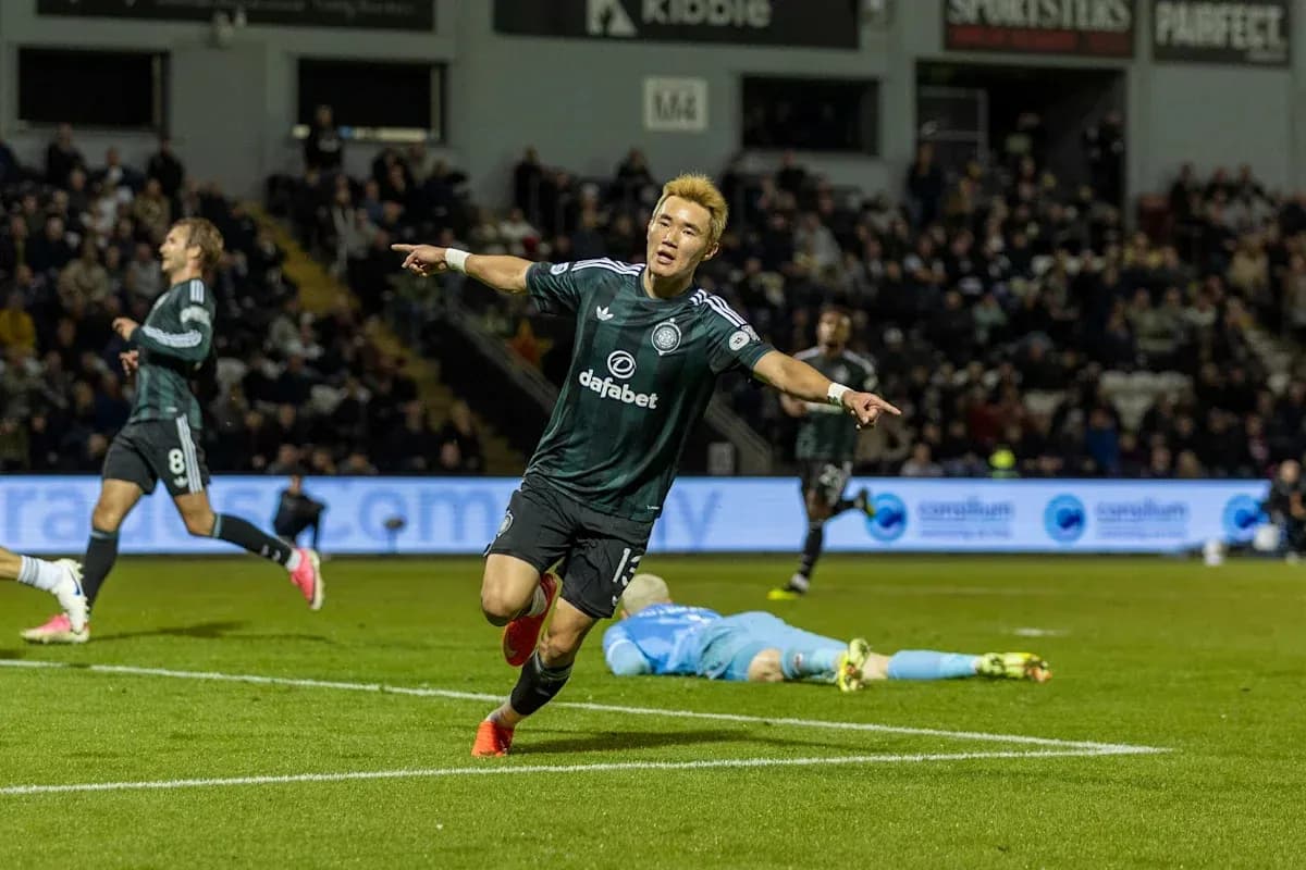 Player celebrating goal with teammates in match Player celebrating goal with teammates in match