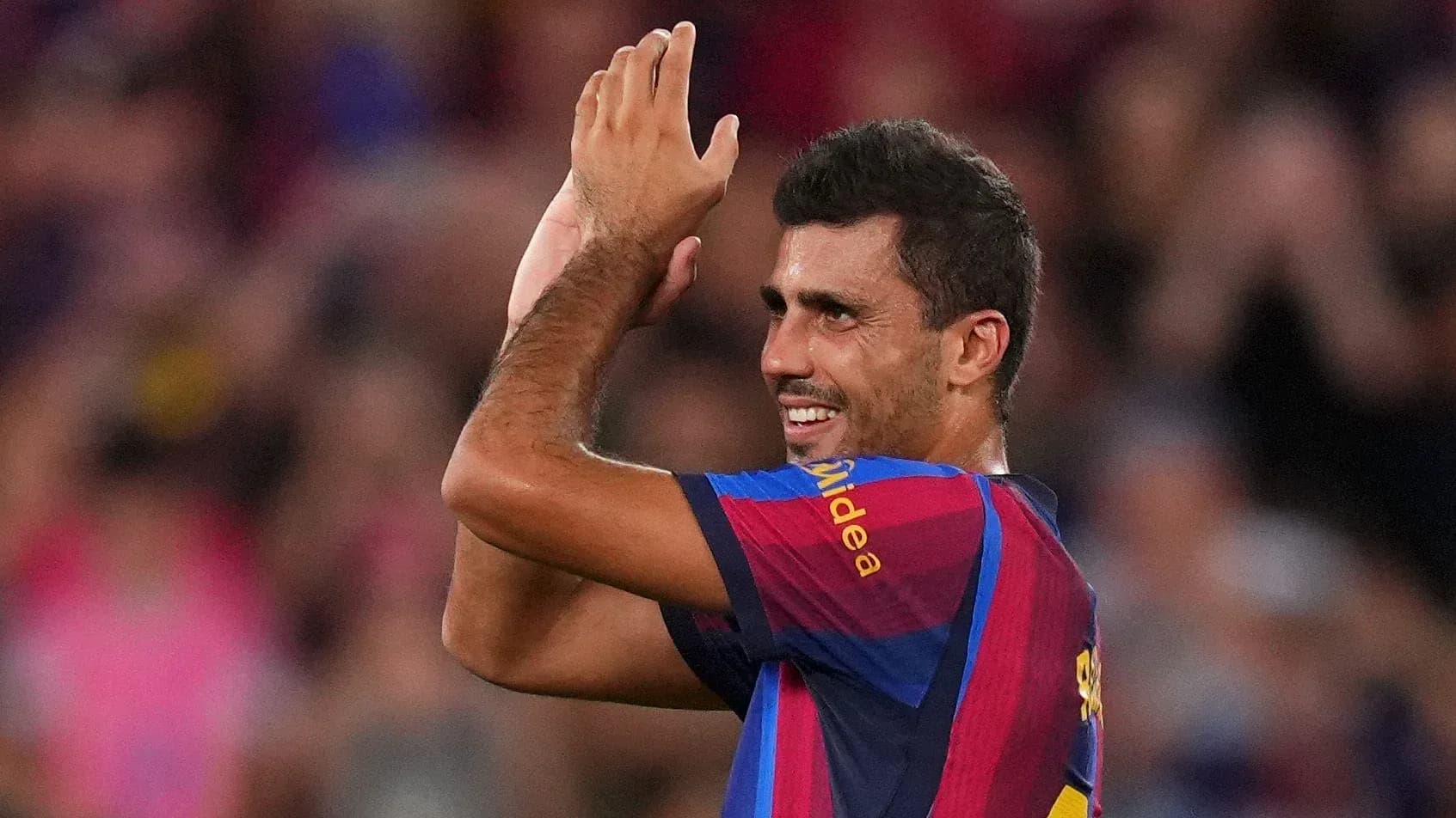 Player celebrating and applauding fans at stadium Player celebrating and applauding fans at stadium