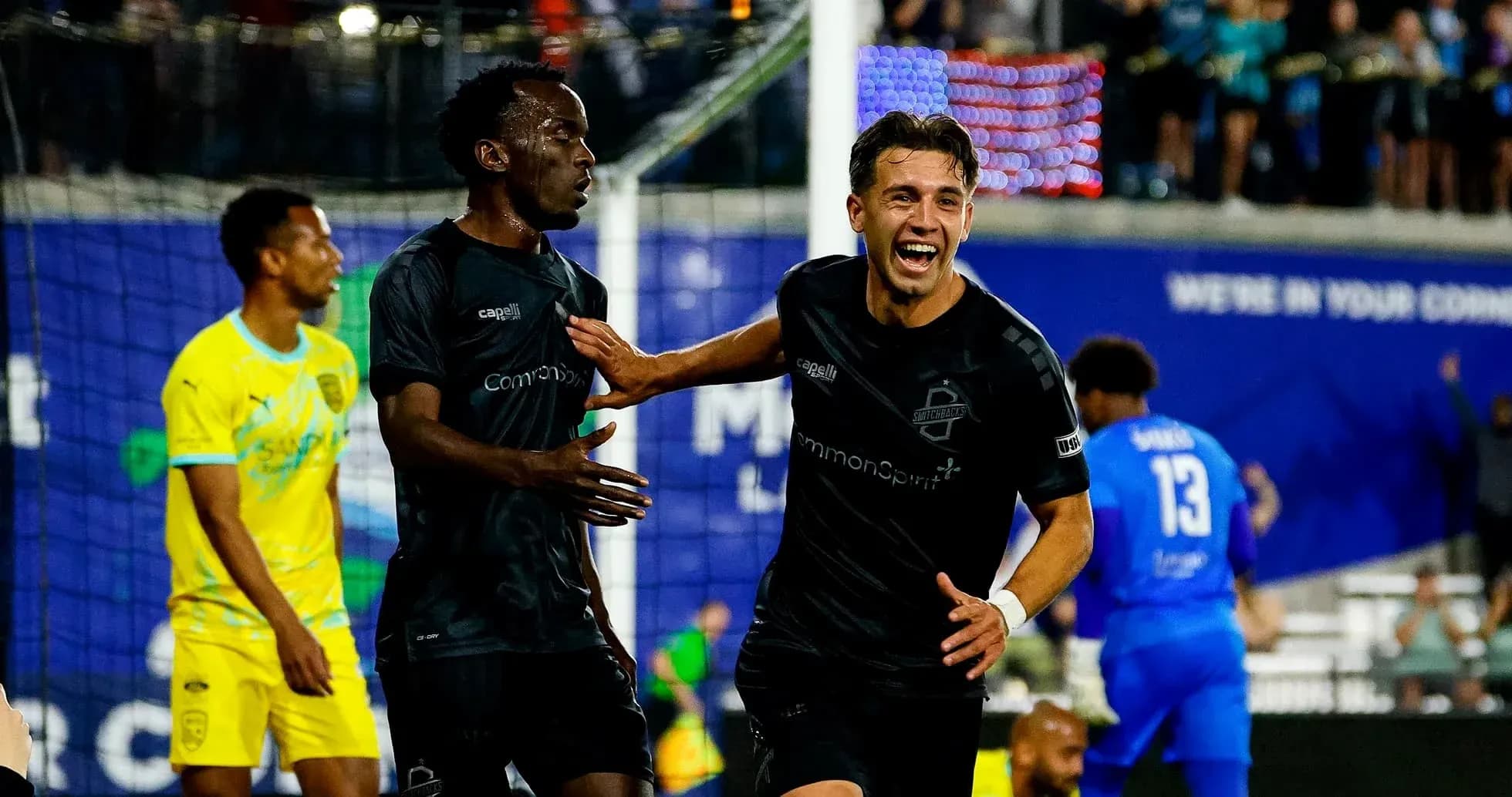 Players celebrating a goal during USL Championship match Players celebrating a goal during USL Championship match