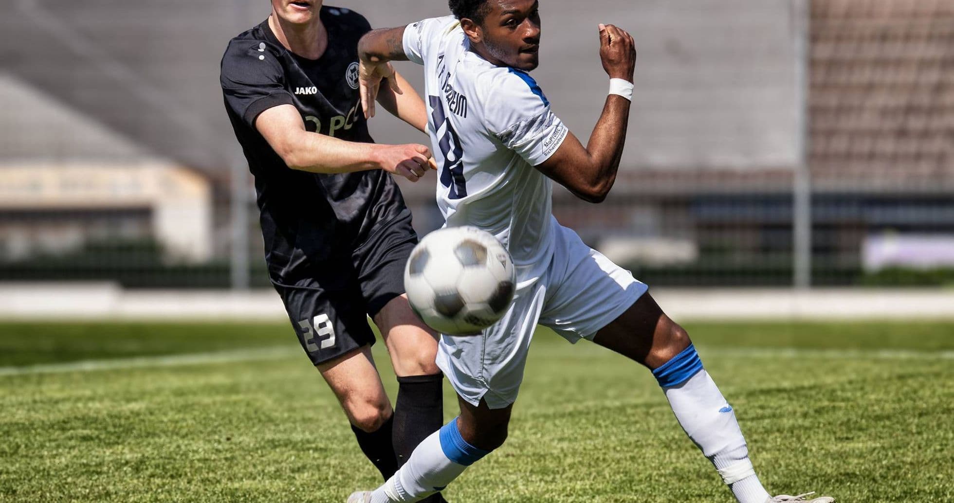 Player from Monheim passing the ball against Germania Ratingen Player from Monheim passing the ball against Germania Ratingen