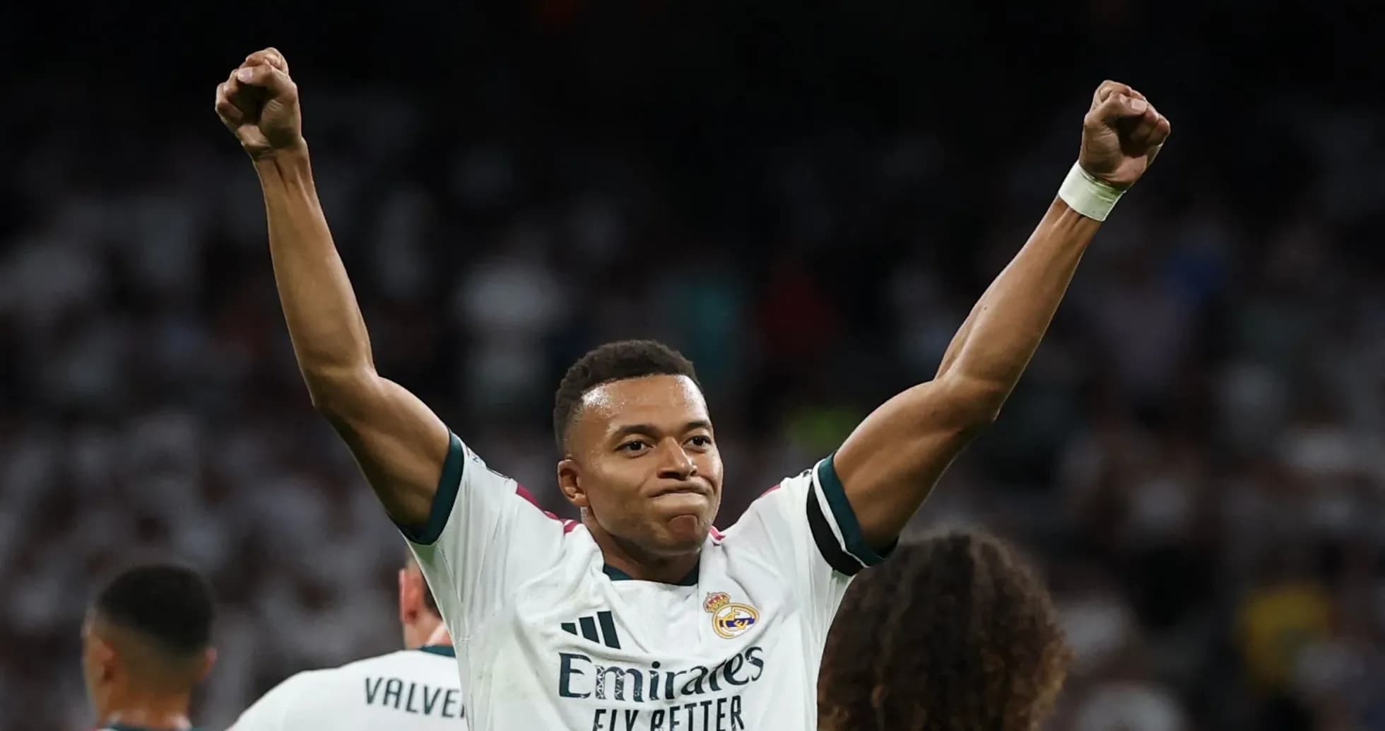 Player celebrating victory with raised fists Player celebrating victory with raised fists