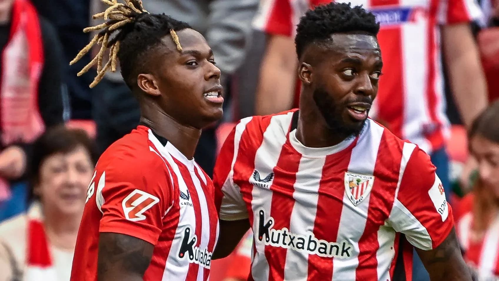Two players celebrating during a football match Two players celebrating during a football match