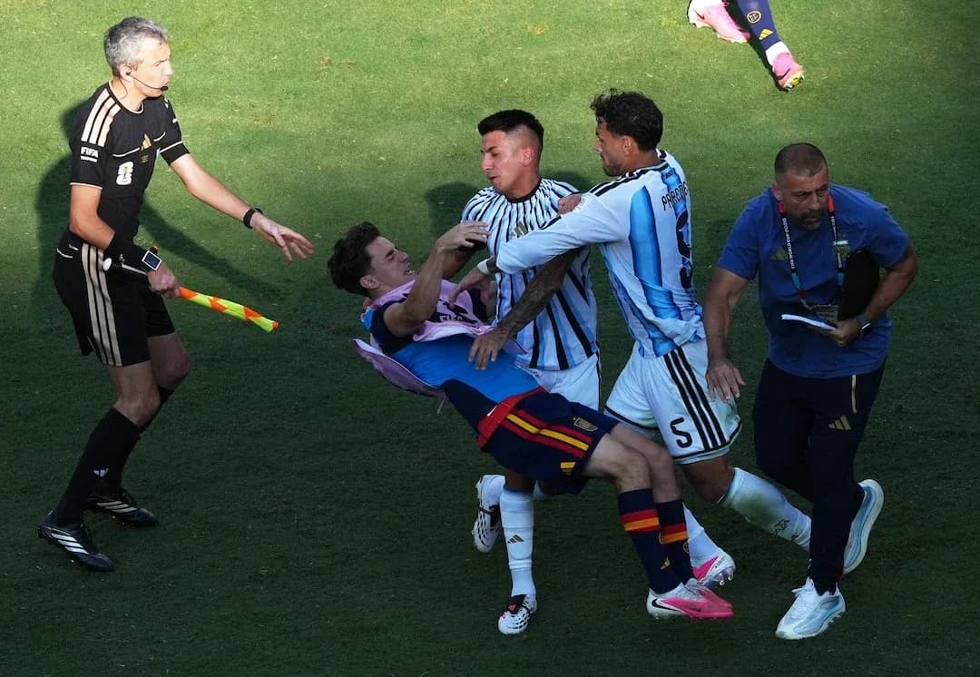 Spain and Argentina players clashing on the field Spain and Argentina players clashing on the field