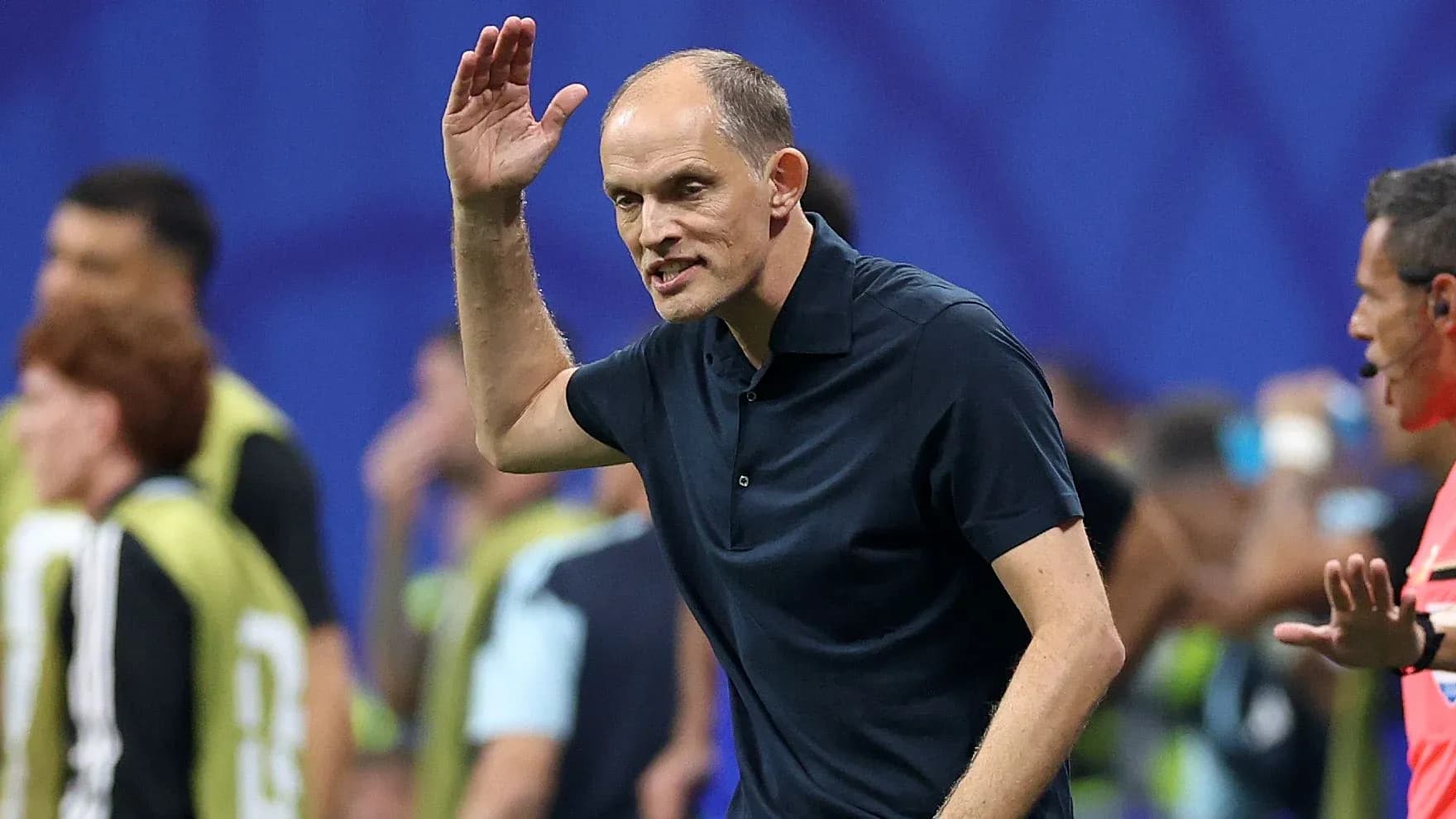 Coach gesturing during a football match on the sidelines Coach gesturing during a football match on the sidelines
