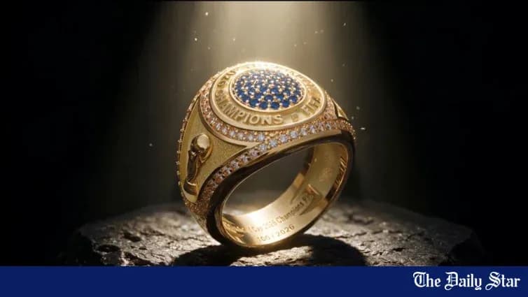 Championship ring displayed on a dark surface Championship ring displayed on a dark surface