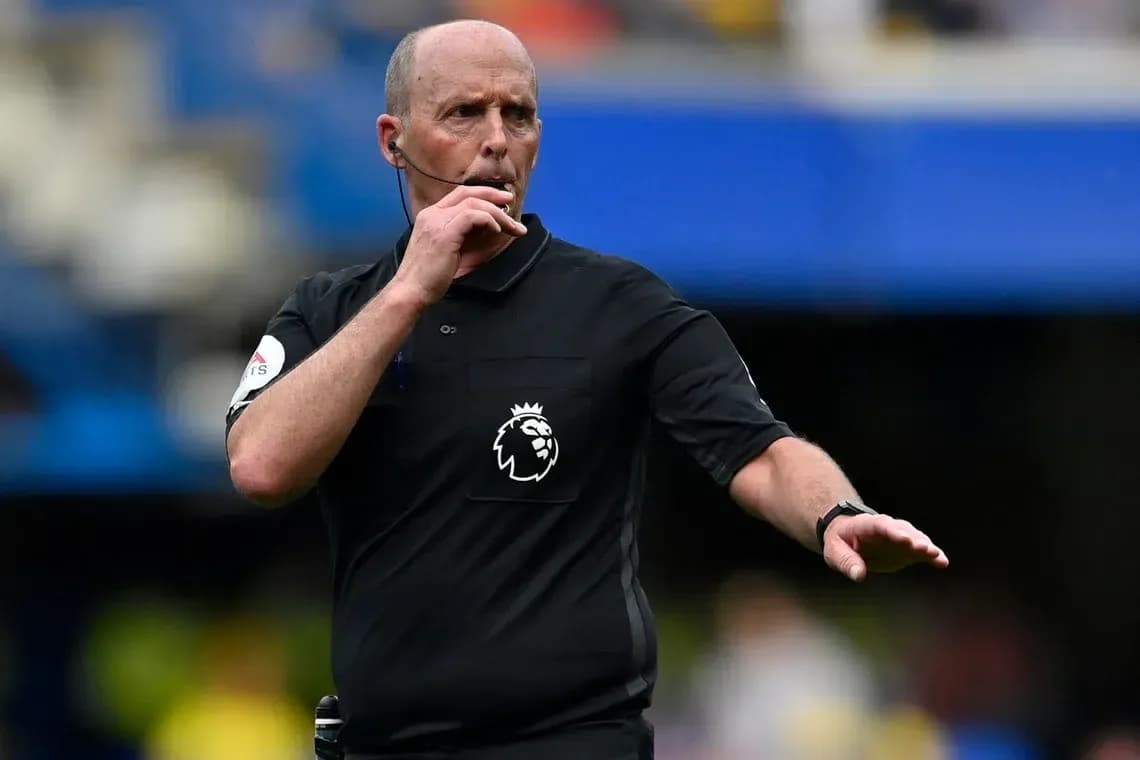 Referee signaling during a Premier League match Referee signaling during a Premier League match
