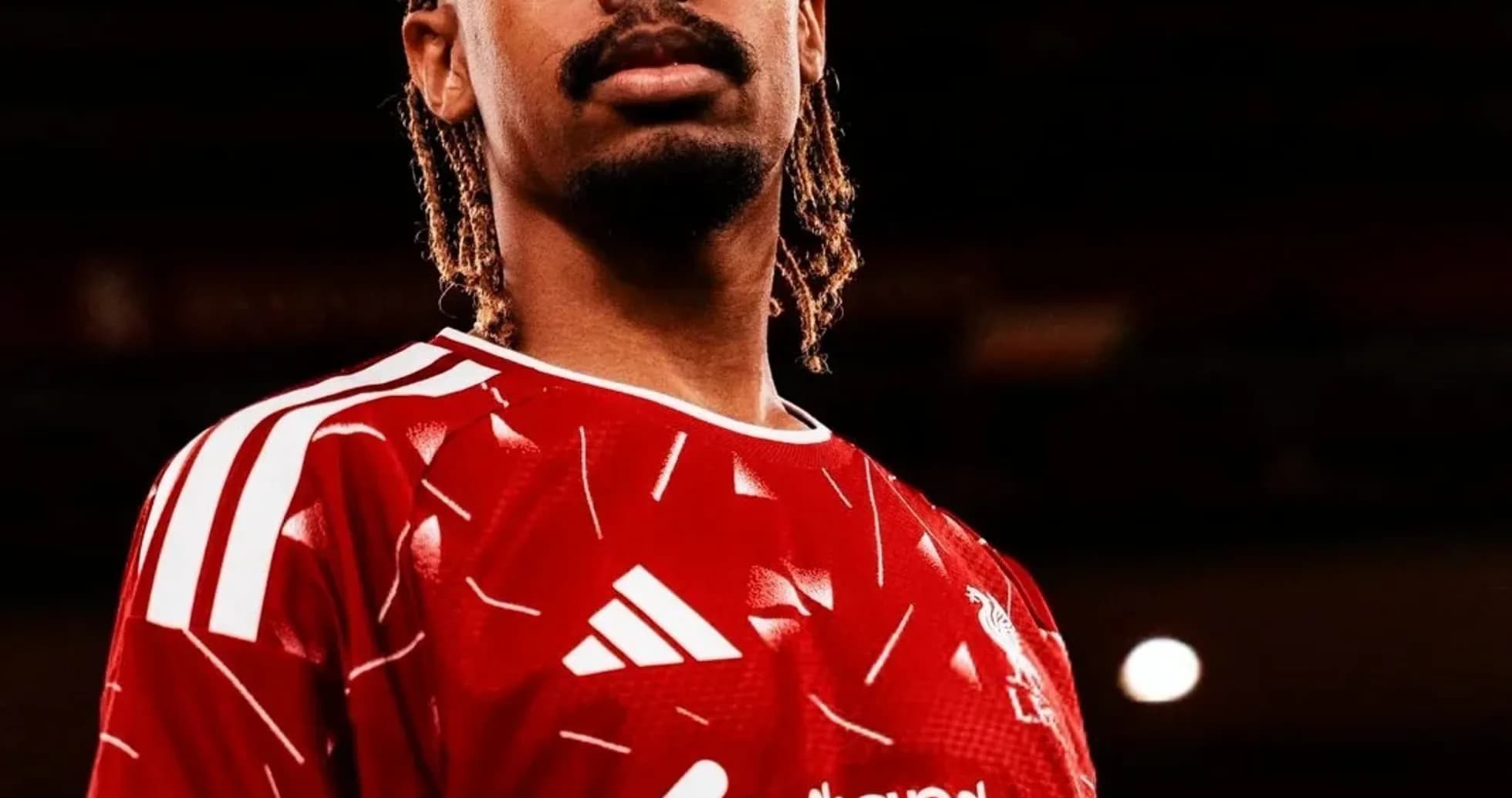 Player posing in Liverpool jersey with braids Player posing in Liverpool jersey with braids