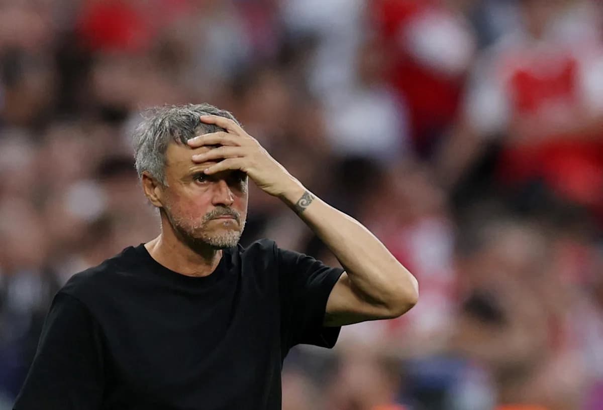Coach with hand on forehead during match Coach with hand on forehead during match