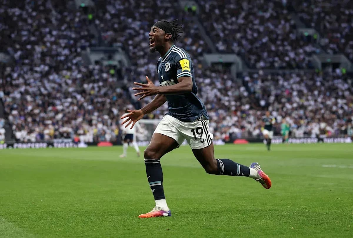 Player celebrating a goal on the pitch Player celebrating a goal on the pitch