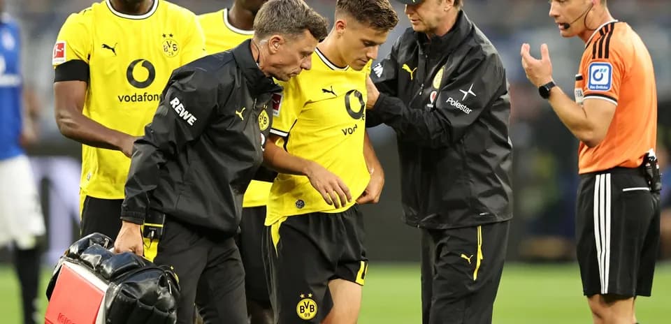 Borussia Dortmund player receiving medical attention on field Borussia Dortmund player receiving medical attention on field