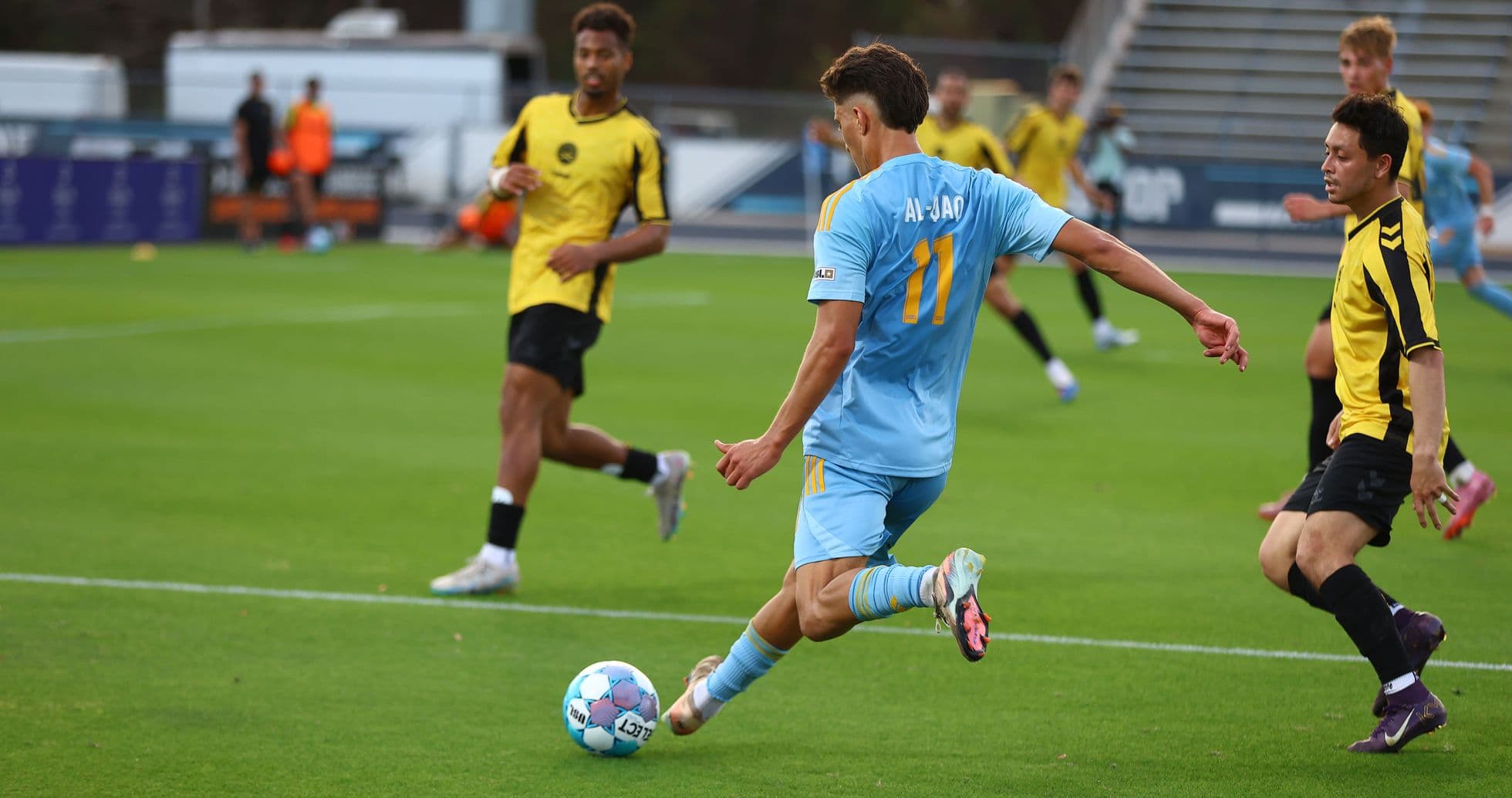 Player from Sporting JAX kicking the ball Player from Sporting JAX kicking the ball
