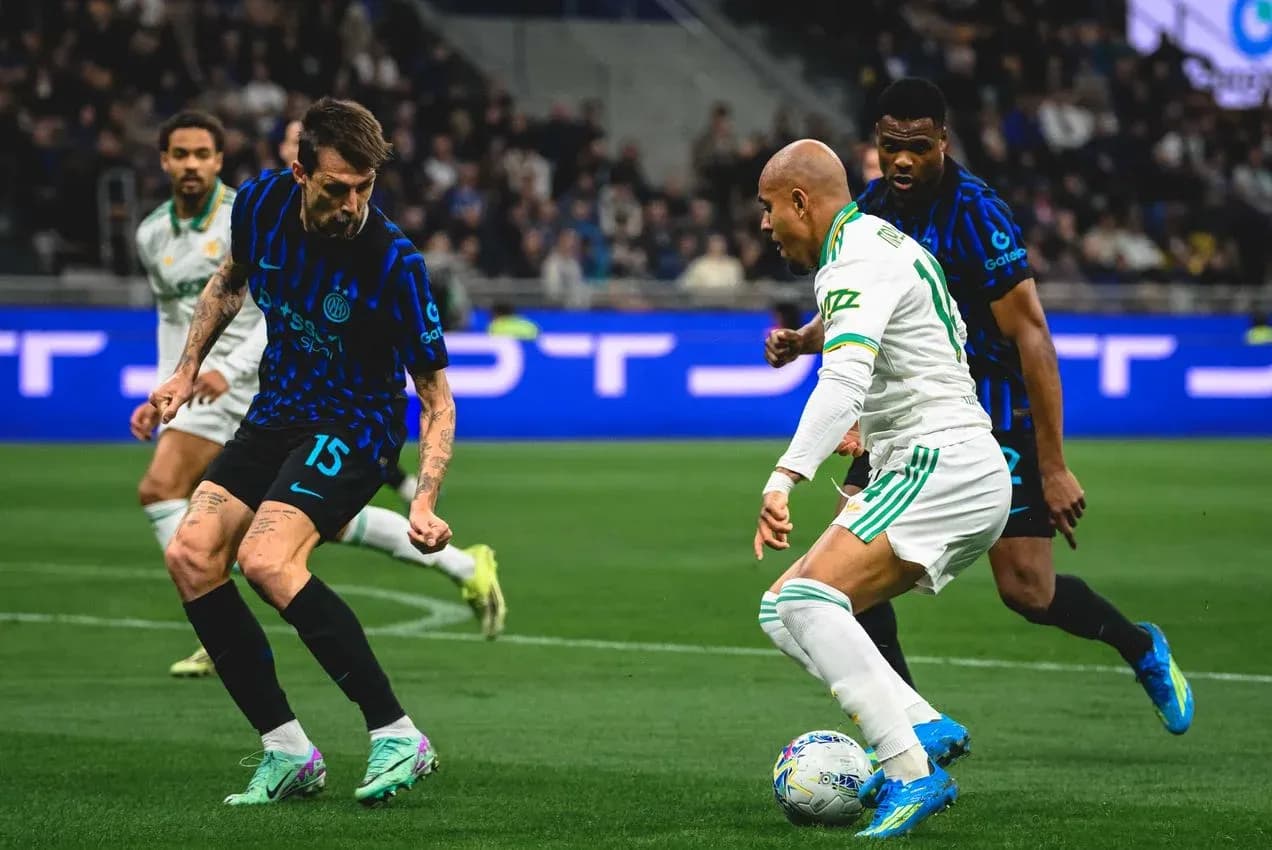 Inter player defending against AS Roma attacker Inter player defending against AS Roma attacker