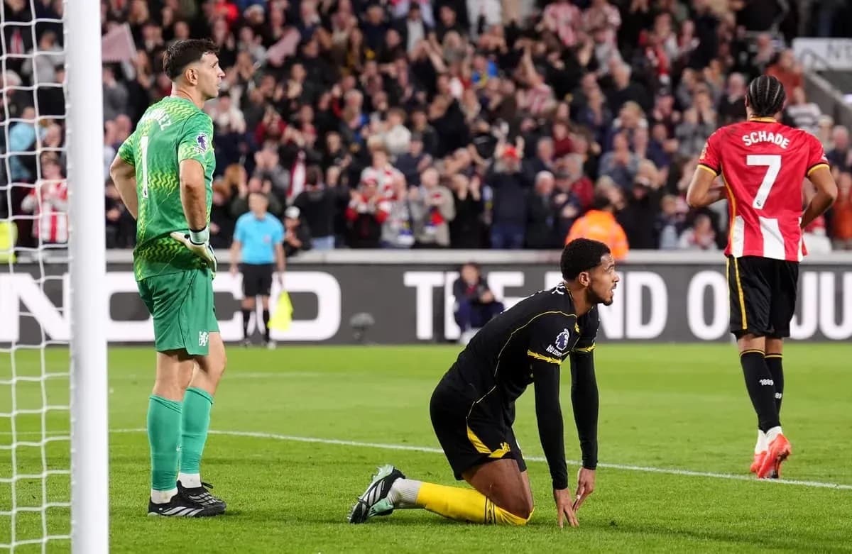 Goalkeeper and defender react after conceding a goal Goalkeeper and defender react after conceding a goal